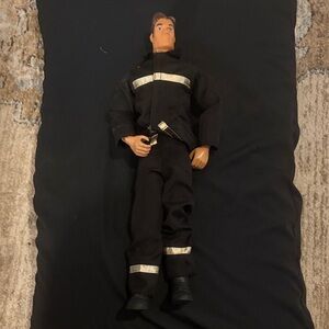 Hasbro Action Figure with Black and White Outfit vintage fireman